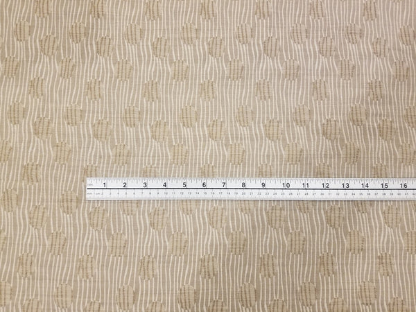 Brown and Cream Matelasse Fabric by Kravet Couture with ruler